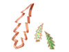 Copper Christmas tree cookie cutter with two decorated cookies on a white background