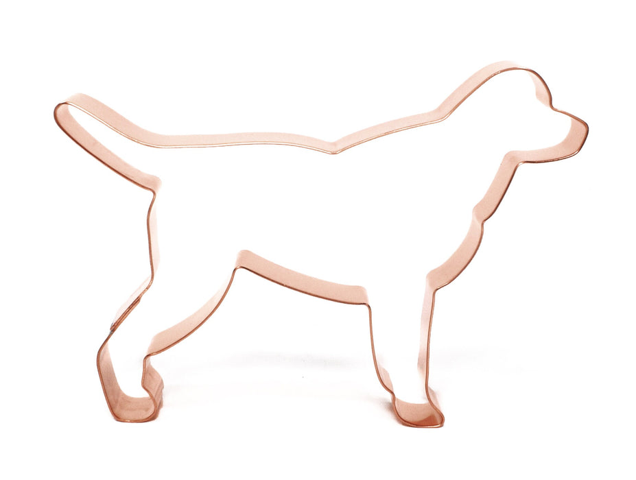 Labrador cookie cutter on a baking sheet, showcasing its high-quality copper craftsmanship and attention to detail