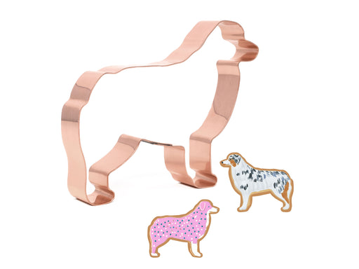 Australian Shepherd copper cookie cutter alongside decorated dog-shaped cookies, perfect for baking, gifts, and dog-themed events.